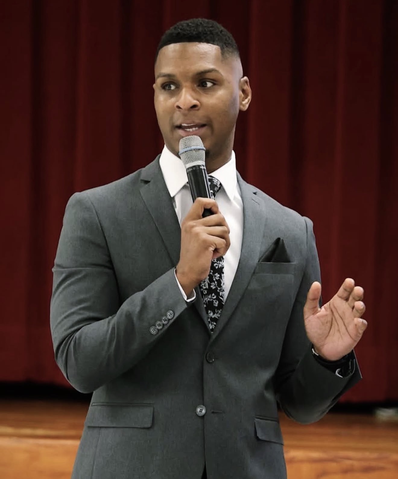 Devante Hill speaking on stage